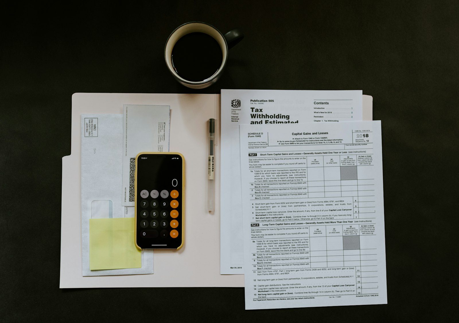 Desk with calculator and paperwork representing mold inspection cost planning